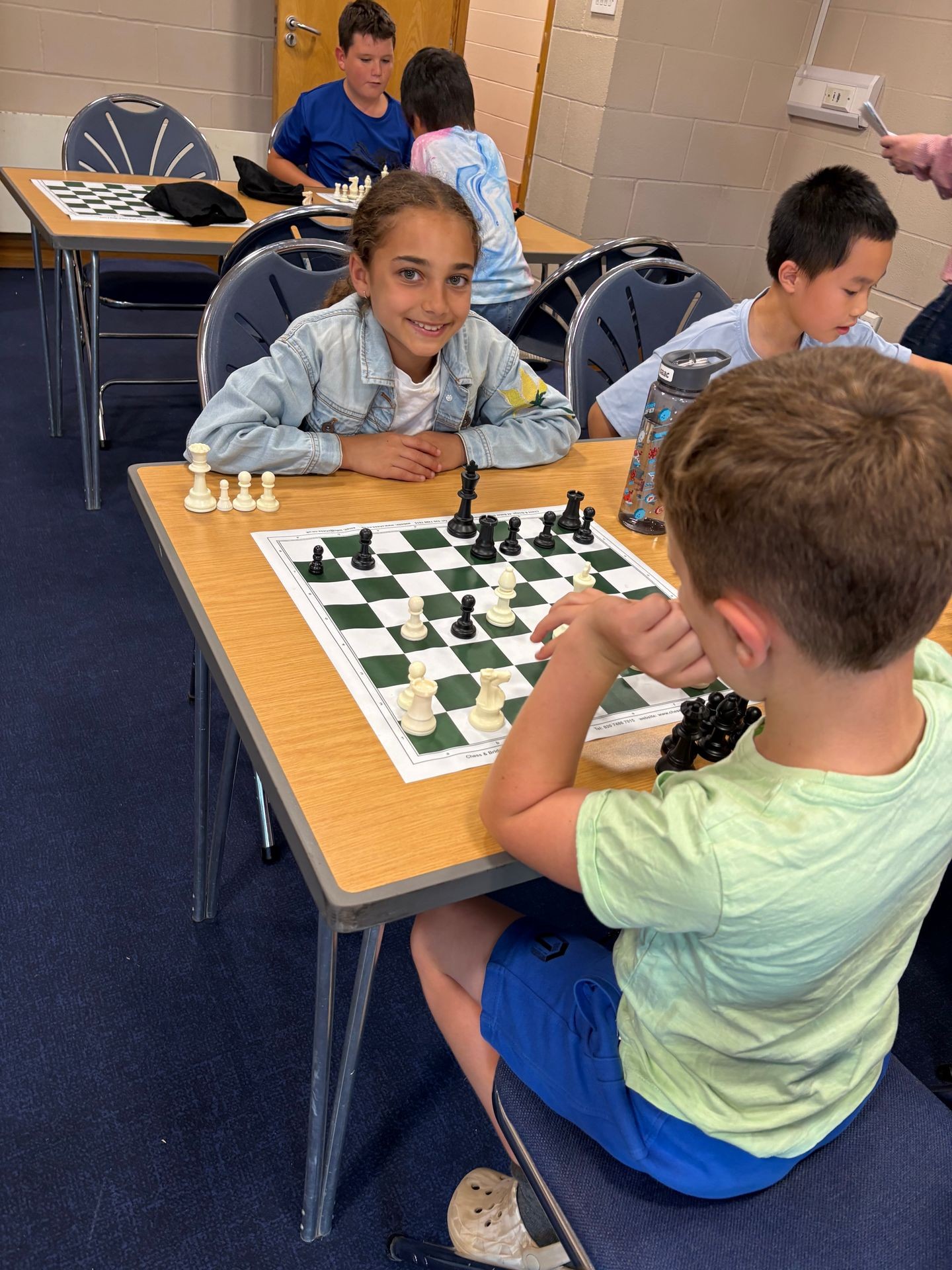 Brave chess players battle at the chessboard Brave chess players battle at the chessboard